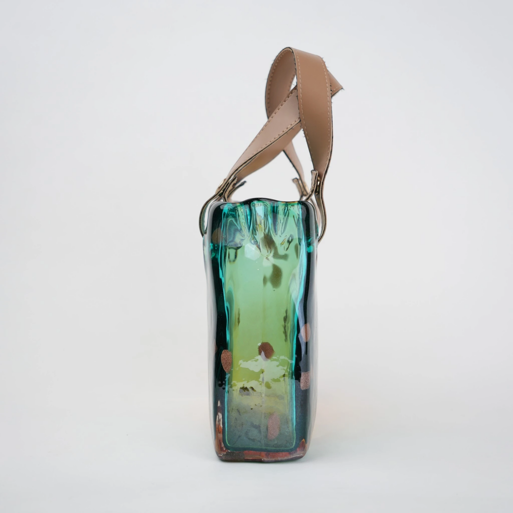 Dual-tone teal and amber glass handbag-shaped vase with bubble-textured surface and arched handle