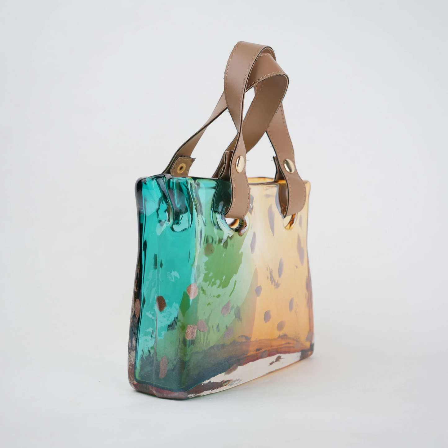 Dual-tone teal and amber glass handbag-shaped vase with bubble-textured surface and arched handle