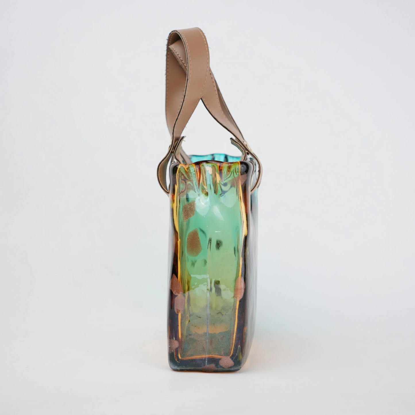 Dual-tone teal and amber glass handbag-shaped vase with bubble-textured surface and arched handle