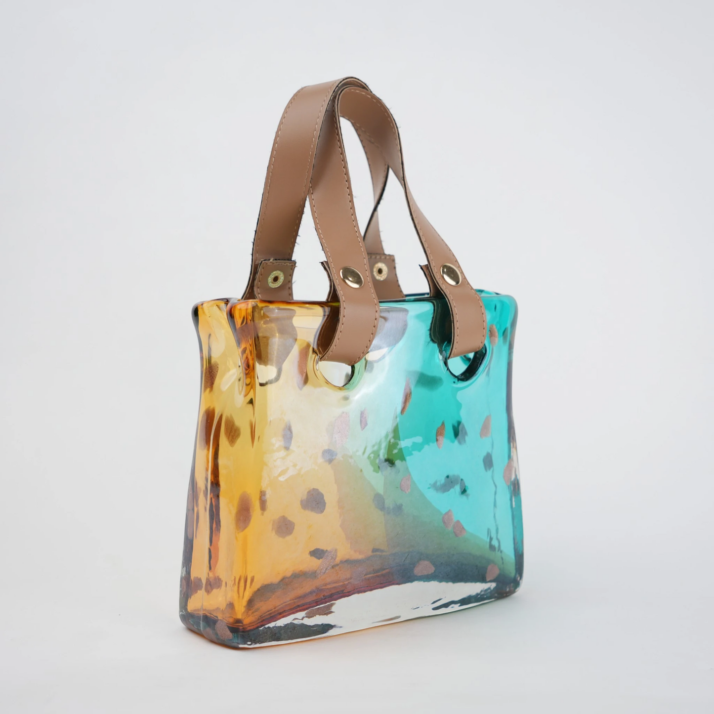Dual-tone teal and amber glass handbag-shaped vase with bubble-textured surface and arched handle