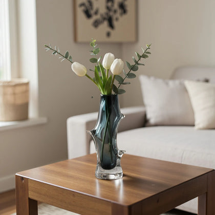 Clear glass stem vase with a branch-like shape and an inner core detail.