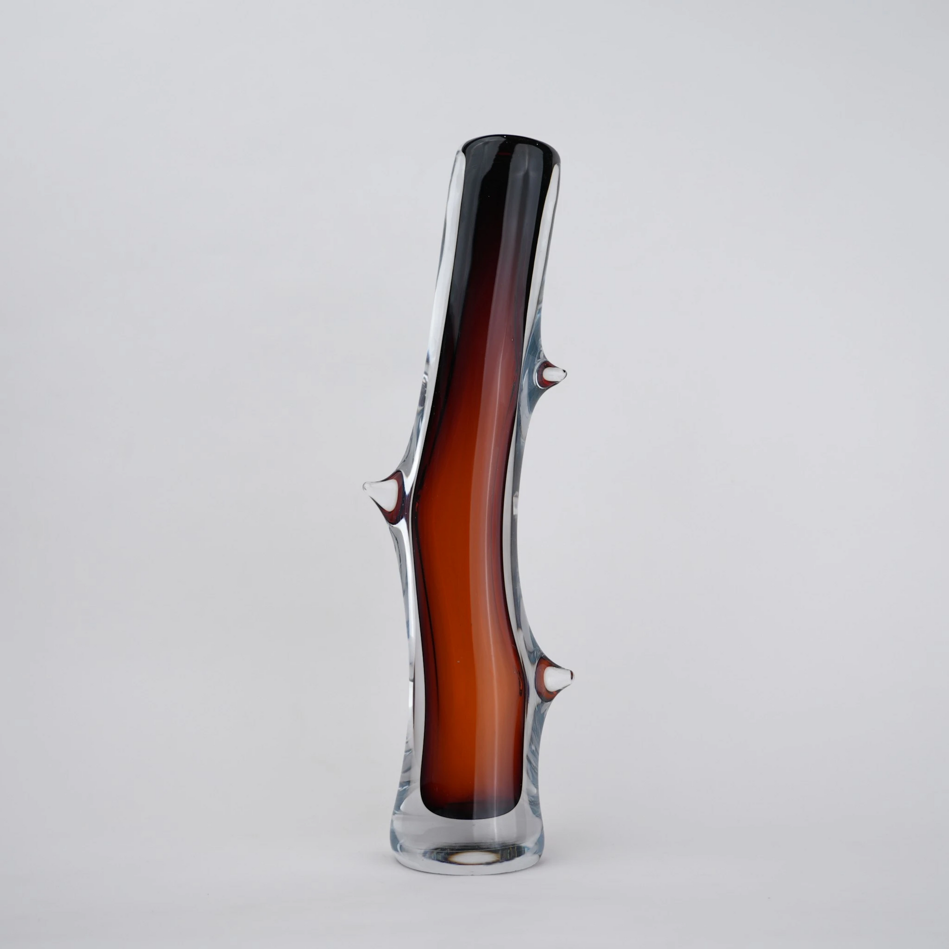 Clear glass stem vase with a branch-like shape and an inner core detail.