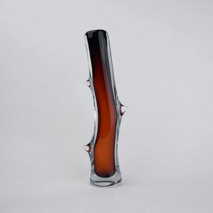Clear glass stem vase with a branch-like shape and an inner core detail.