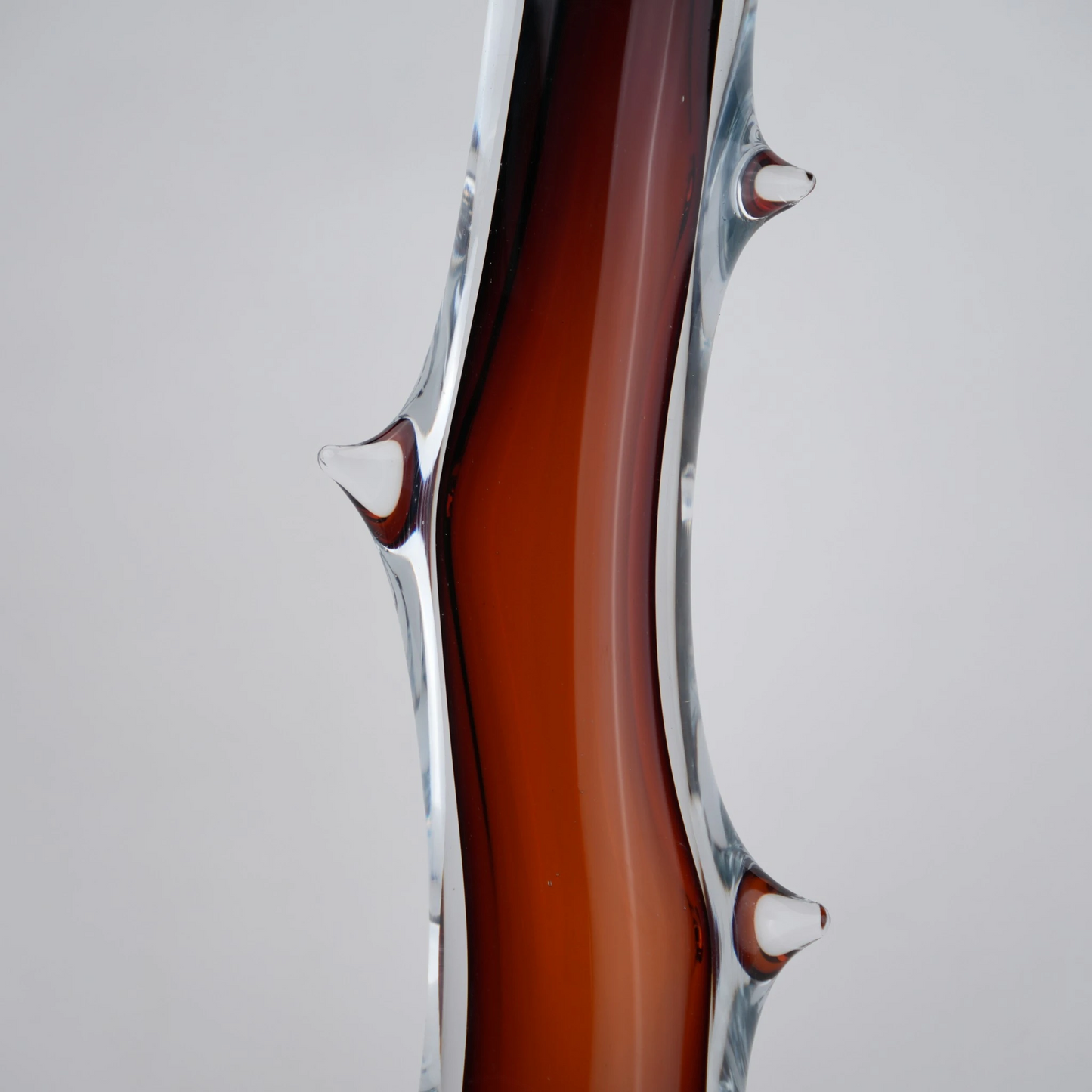 Clear glass stem vase with a branch-like shape and an inner core detail.