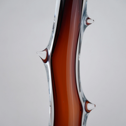 Clear glass stem vase with a branch-like shape and an inner core detail.