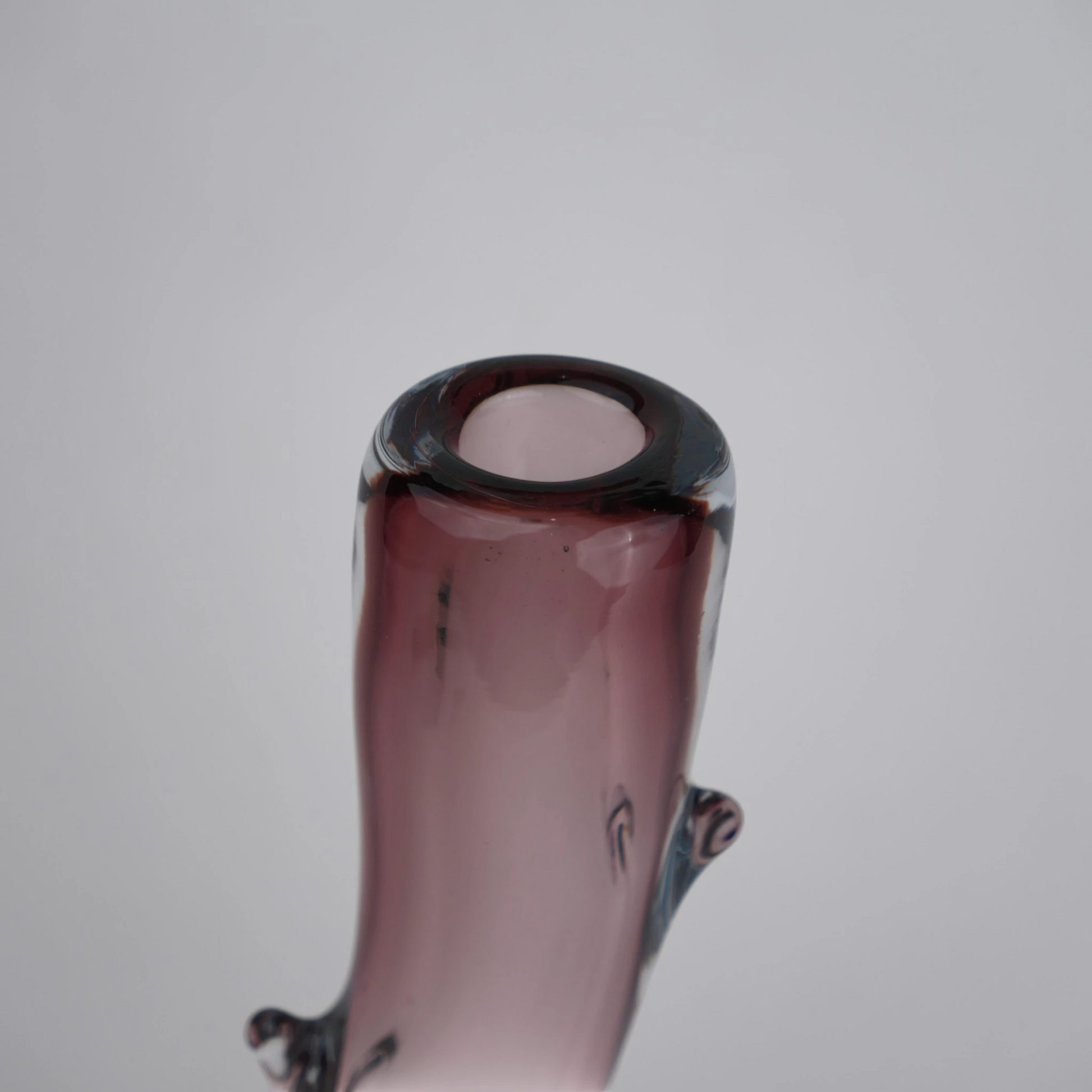 Burgundy stem vase macro of curved rim