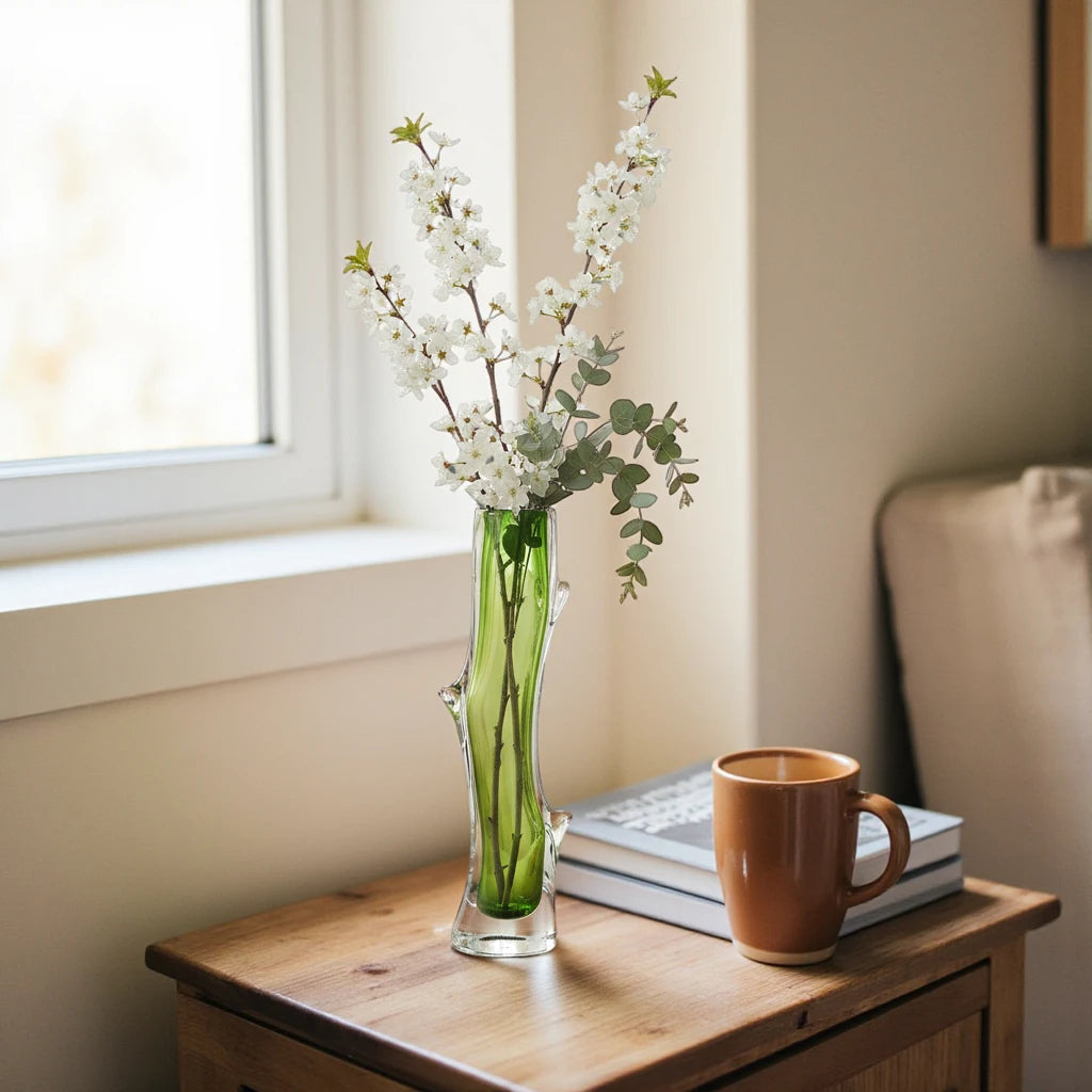 Clear glass stem vase with a branch-like shape and an inner core detail.
