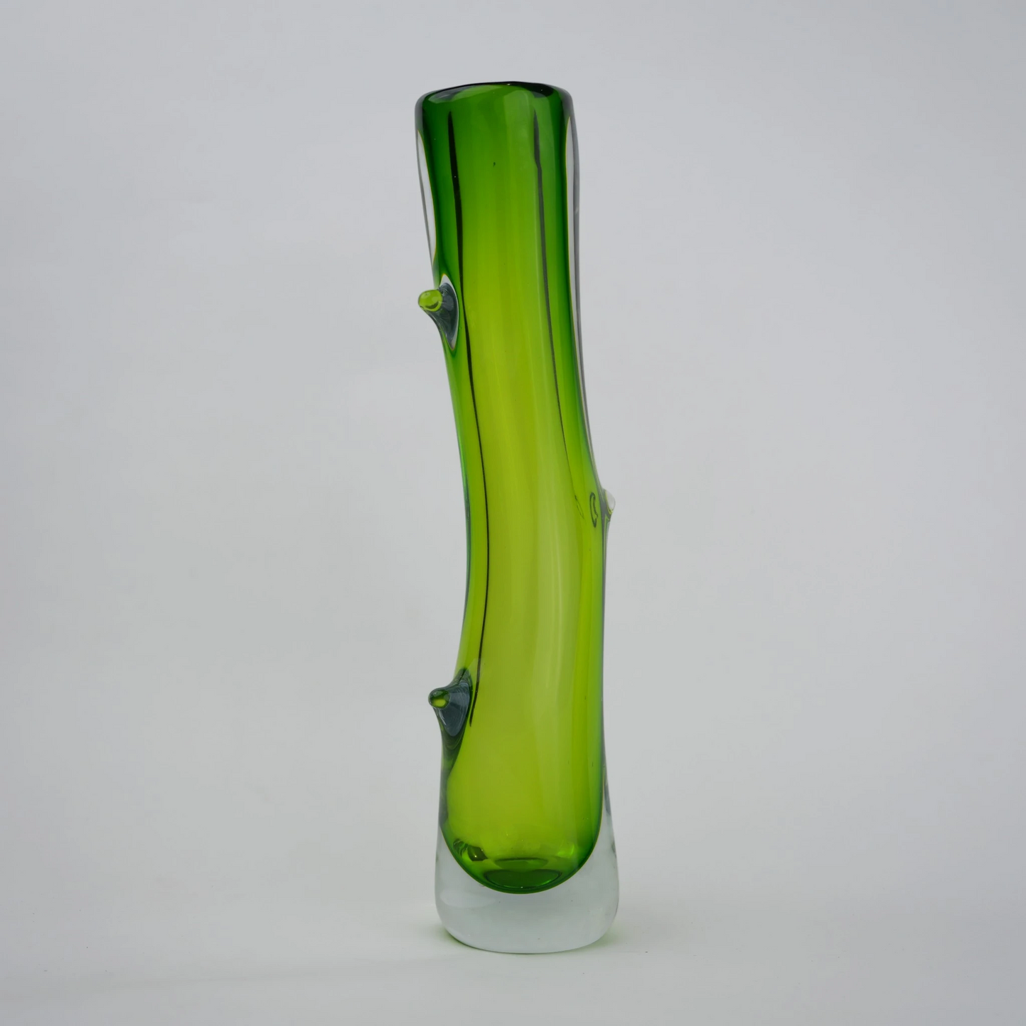 Clear glass stem vase with a branch-like shape and an inner core detail.