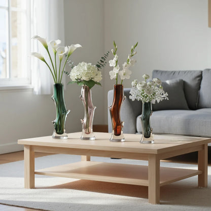 Clear glass stem vase with a branch-like shape and an inner core detail.