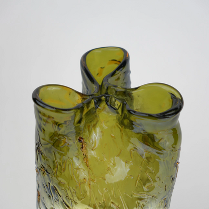 Olive green crackle-textured cylindrical glass vase with organic surface pattern.