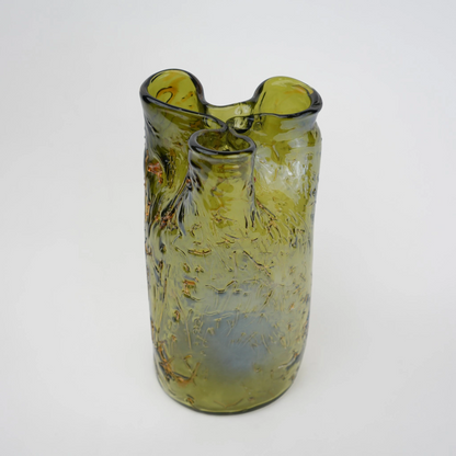 Olive green crackle-textured cylindrical glass vase with organic surface pattern.