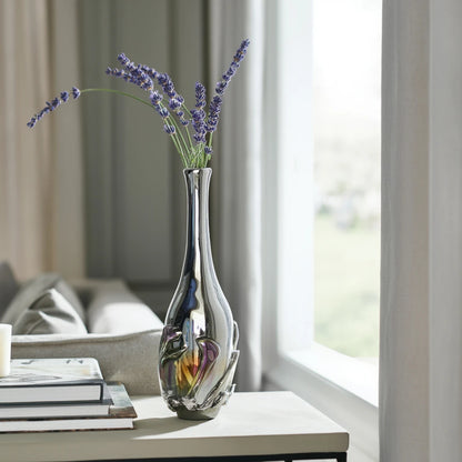 Smoked chrome iridescent glass vase with elongated neck and reflective finish.