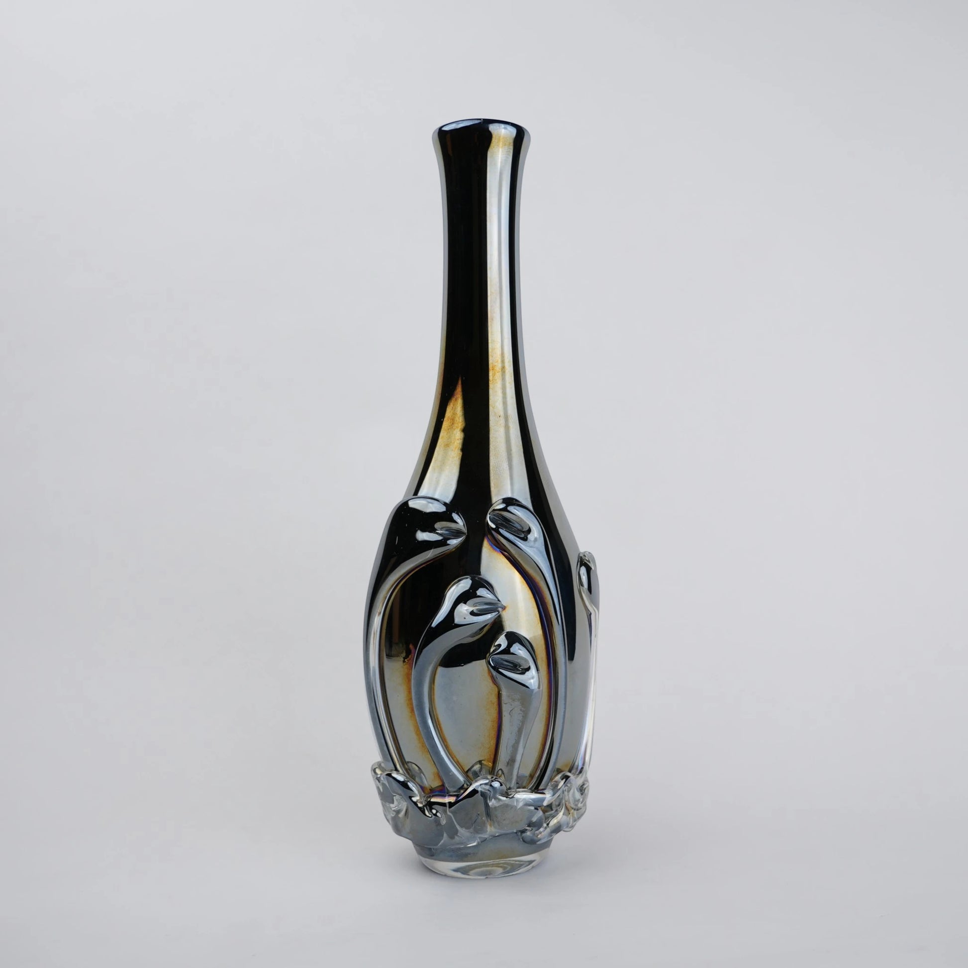 Smoked chrome iridescent glass vase with elongated neck and reflective finish.