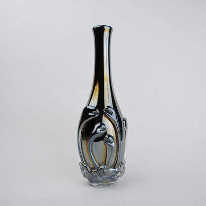 Smoked chrome iridescent glass vase with elongated neck and reflective finish.