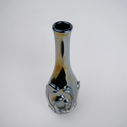 Smoked chrome iridescent glass vase with elongated neck and reflective finish.