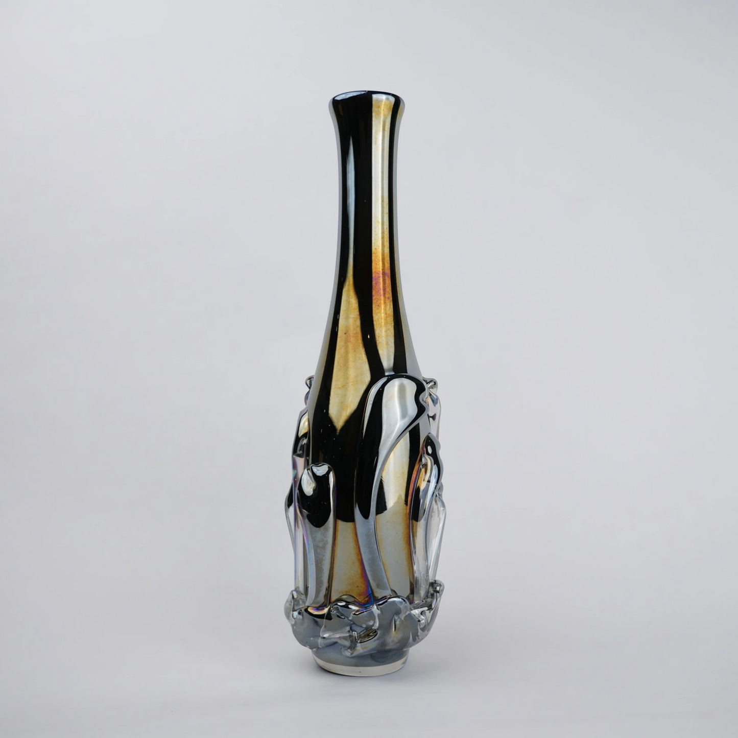Smoked chrome iridescent glass vase with elongated neck and reflective finish.