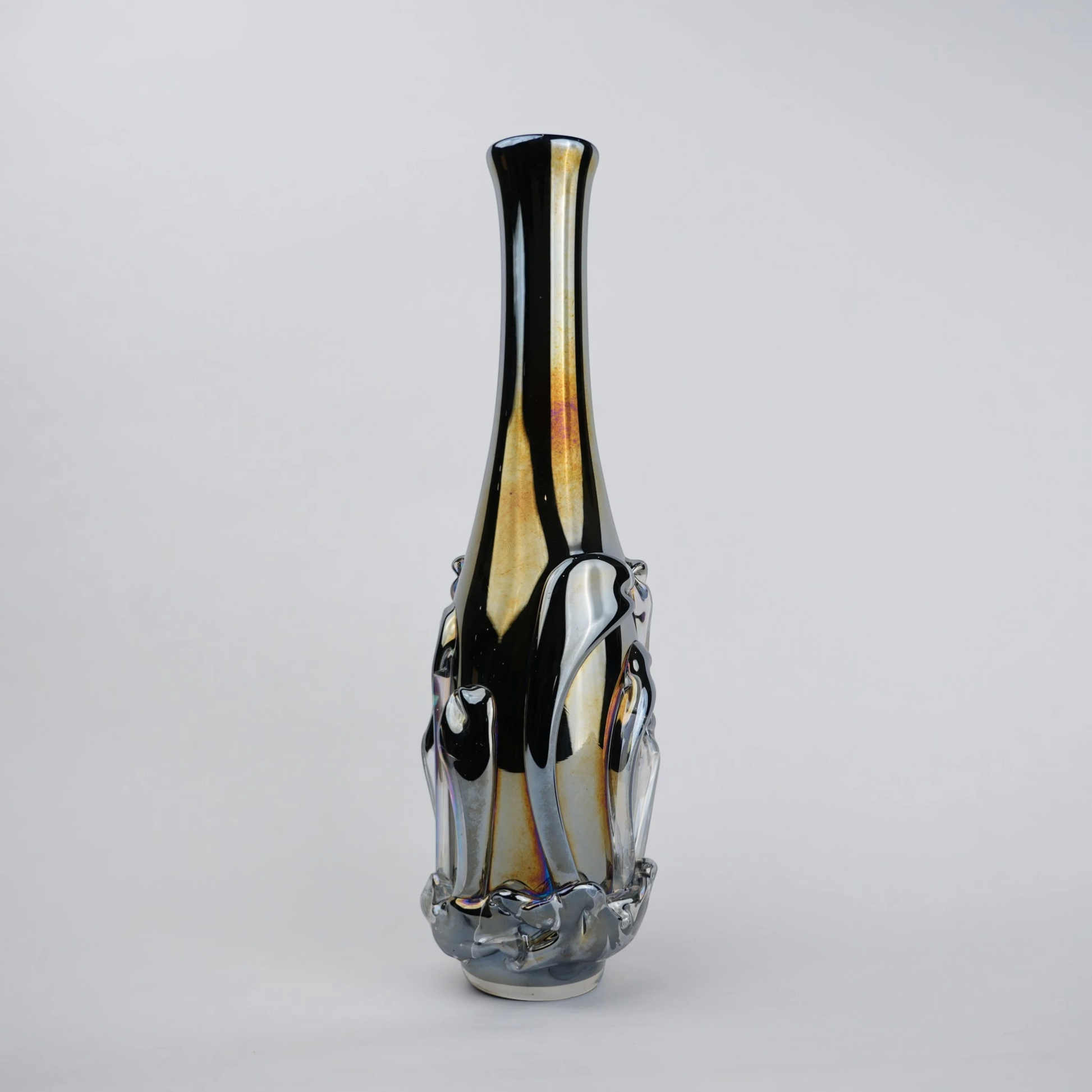 Smoked chrome iridescent glass vase with elongated neck and reflective finish.
