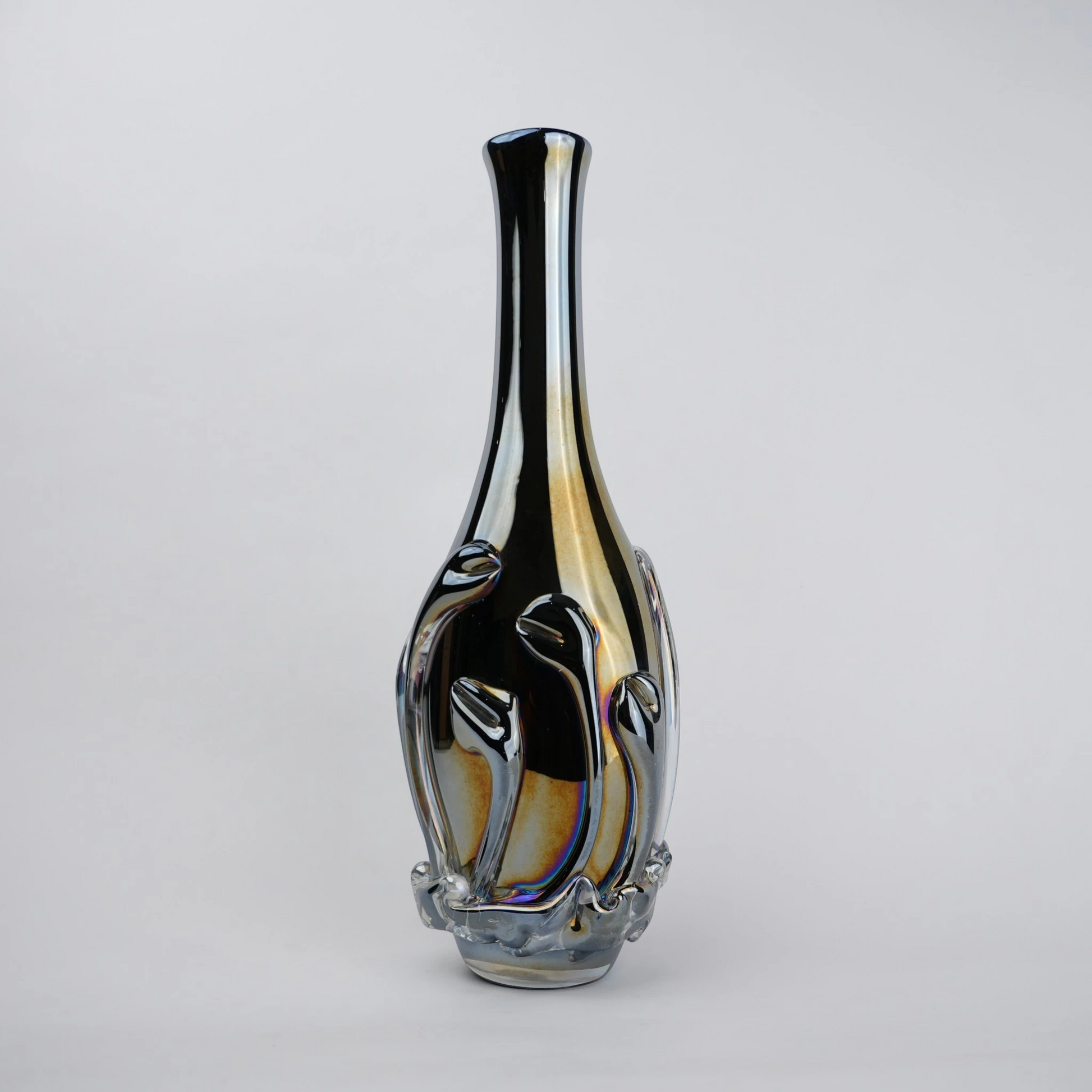 Smoked chrome iridescent glass vase with elongated neck and reflective finish.
