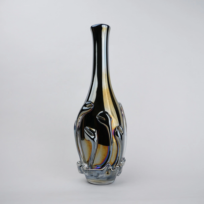 Smoked chrome iridescent glass vase with elongated neck and reflective finish.