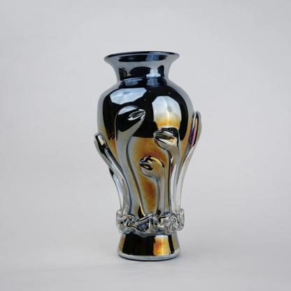 Chrome smoke reflective glass vase with curved body and metallic finish.