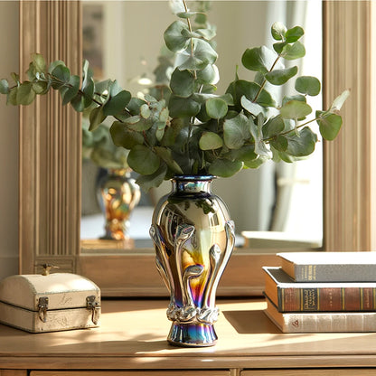 Chrome smoke reflective glass vase with curved body and metallic finish.