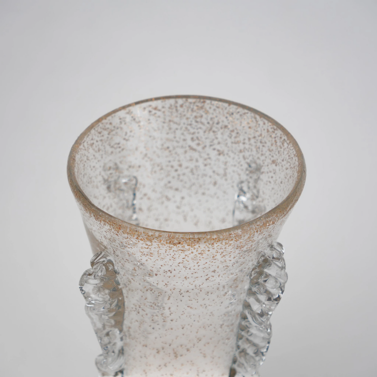 Champagne gold textured glass vase with tapered silhouette and shimmering finish.