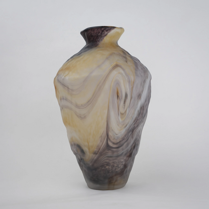 Tall white marble glass vase with flowing pattern and tapered silhouette.
