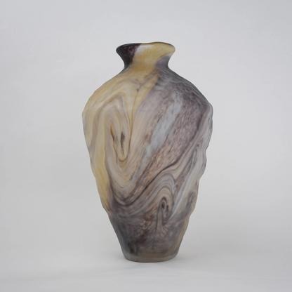 Tall white marble glass vase with flowing pattern and tapered silhouette.