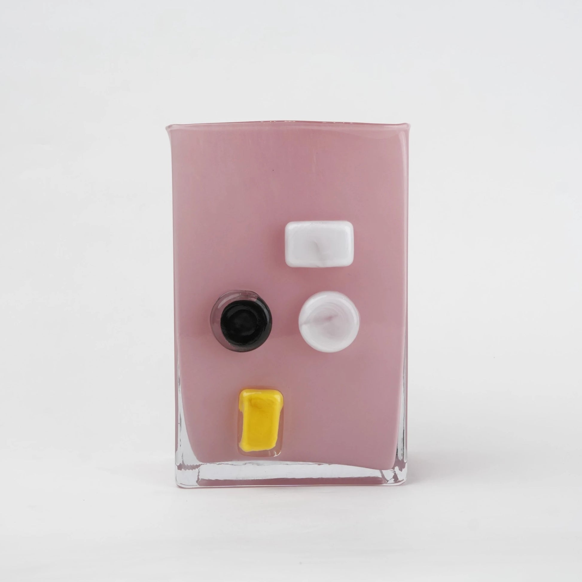 Pink art glass vase with embedded multicolor accents and wide rectangular form.