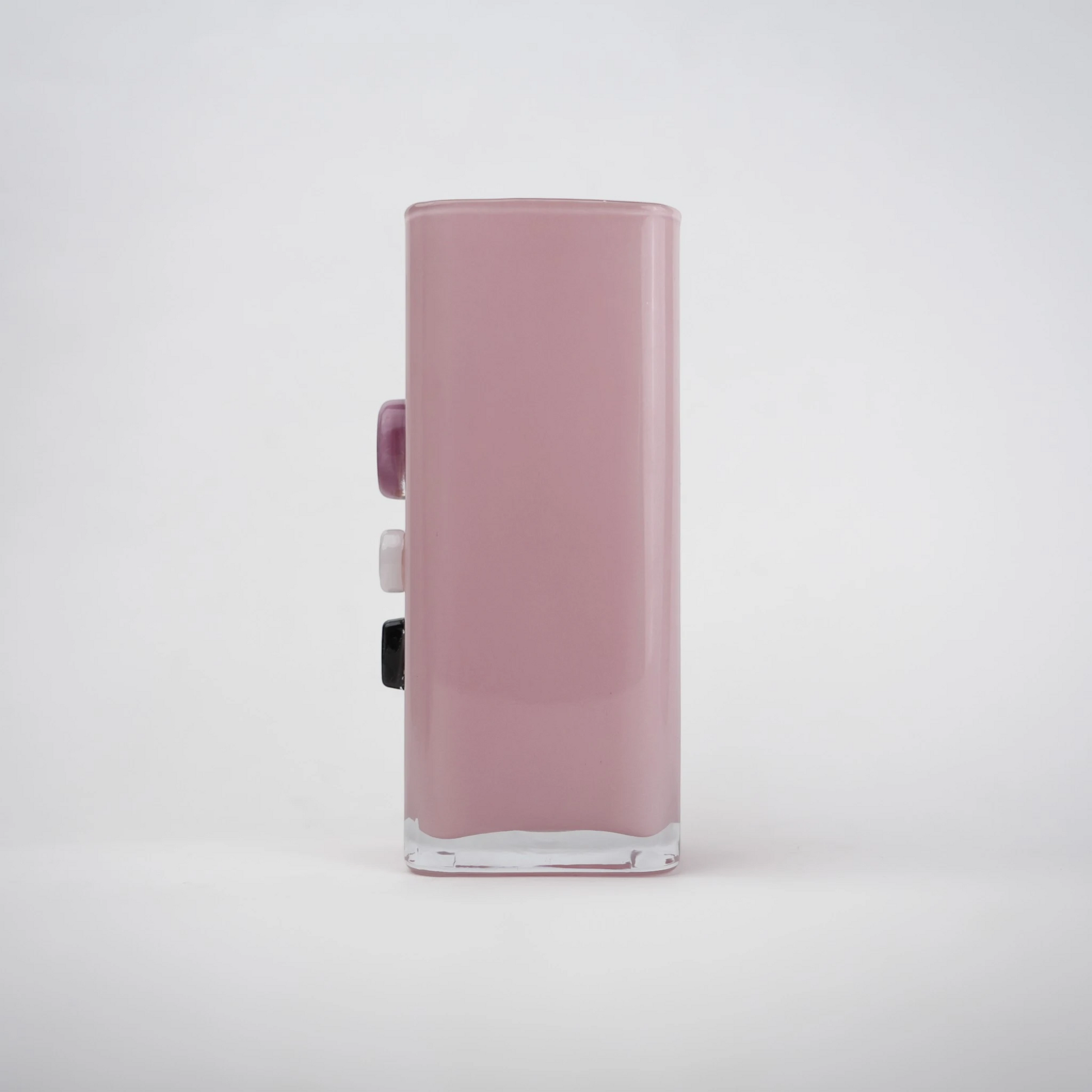 Pink art glass vase with embedded multicolor accents and wide rectangular form.