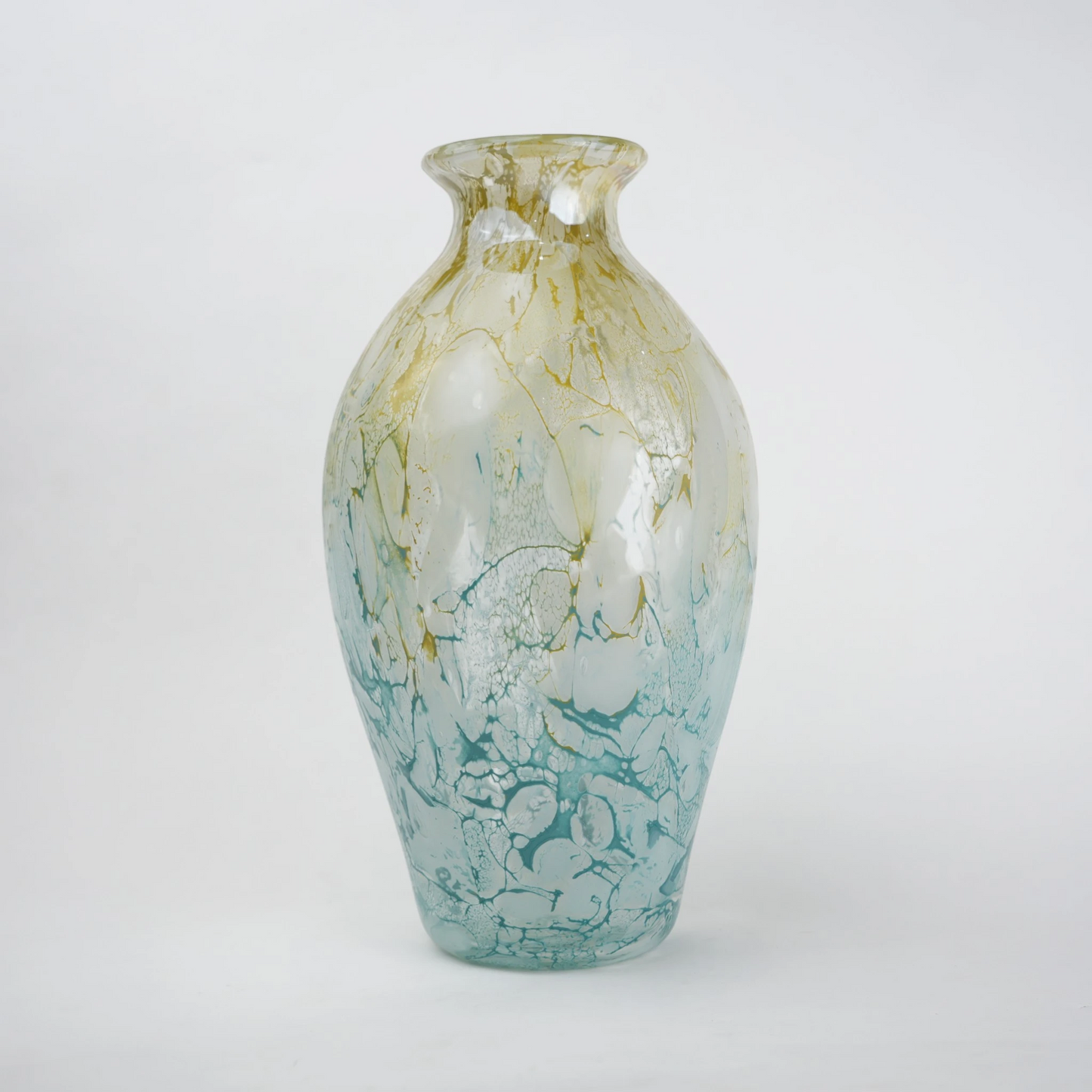 Rounded decorative vase with a narrow neck and marbled finish.