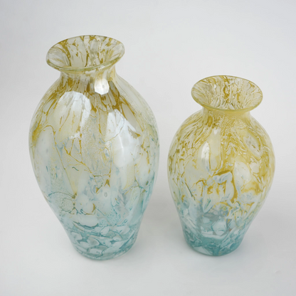 Rounded decorative vase with a narrow neck and marbled finish.