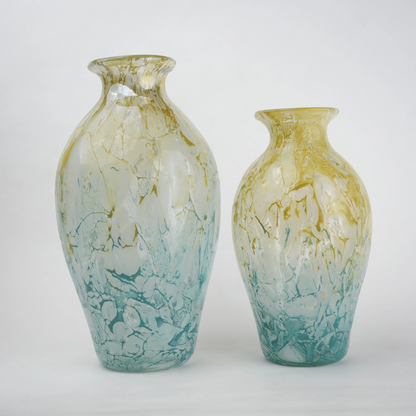 Rounded decorative vase with a narrow neck and marbled finish.