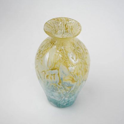 Rounded decorative vase with a narrow neck and marbled finish.