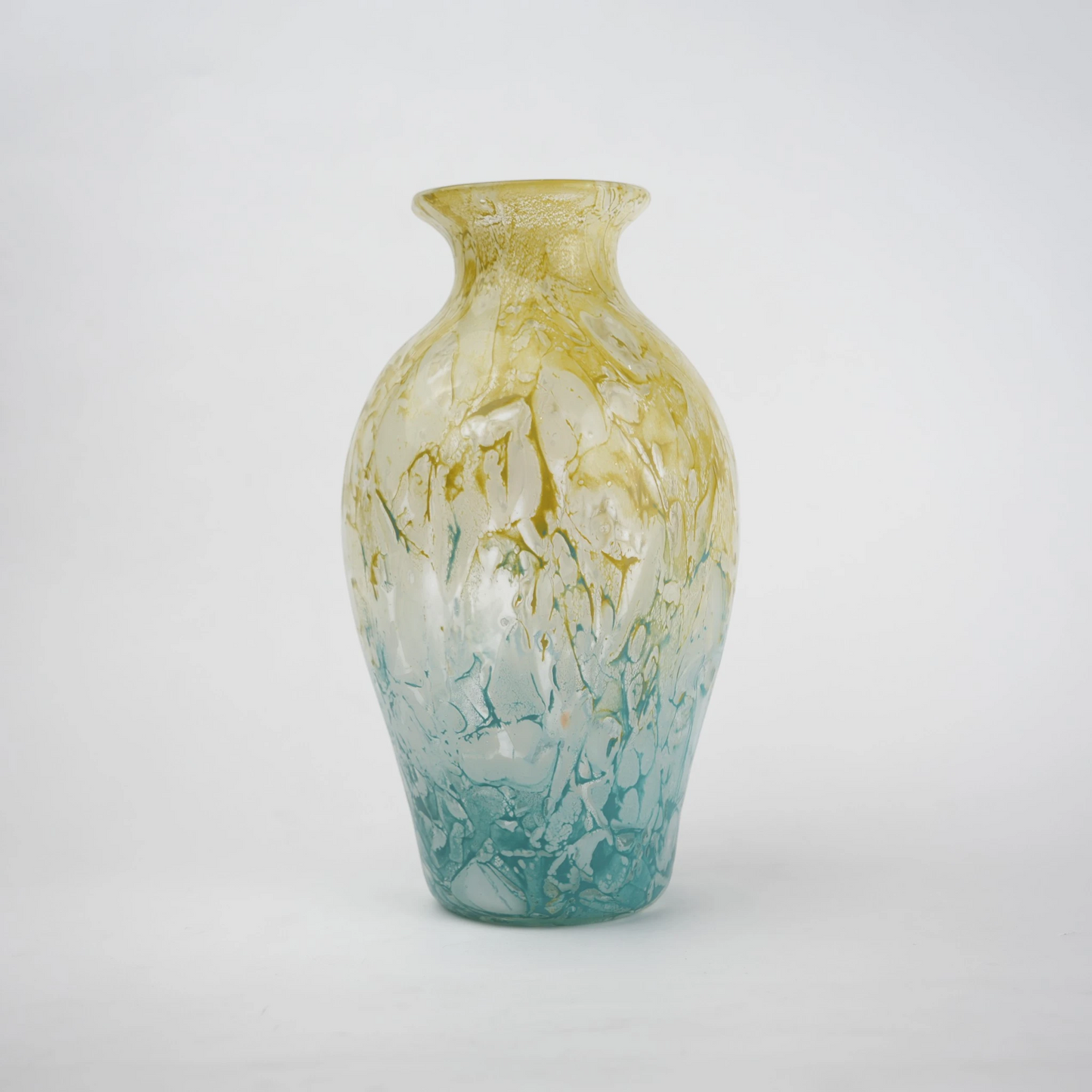 Rounded decorative vase with a narrow neck and marbled finish.