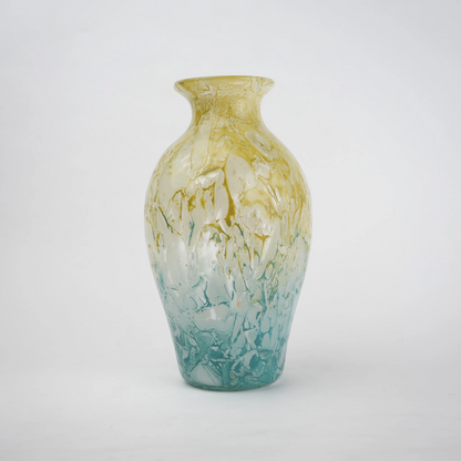 Rounded decorative vase with a narrow neck and marbled finish.