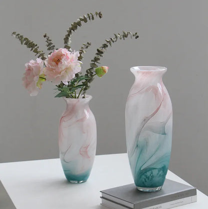 Textured marble-effect glass vase with soft gradient finish and rounded silhouette.