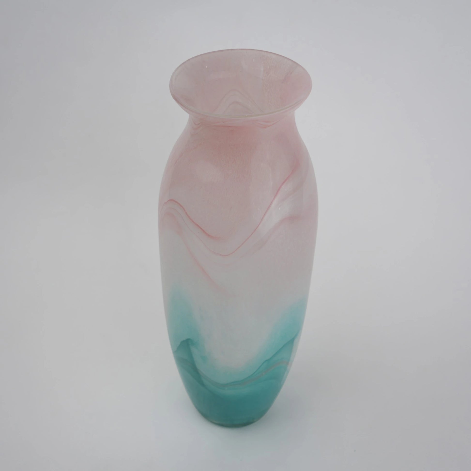 Textured marble-effect glass vase with soft gradient finish and rounded silhouette.