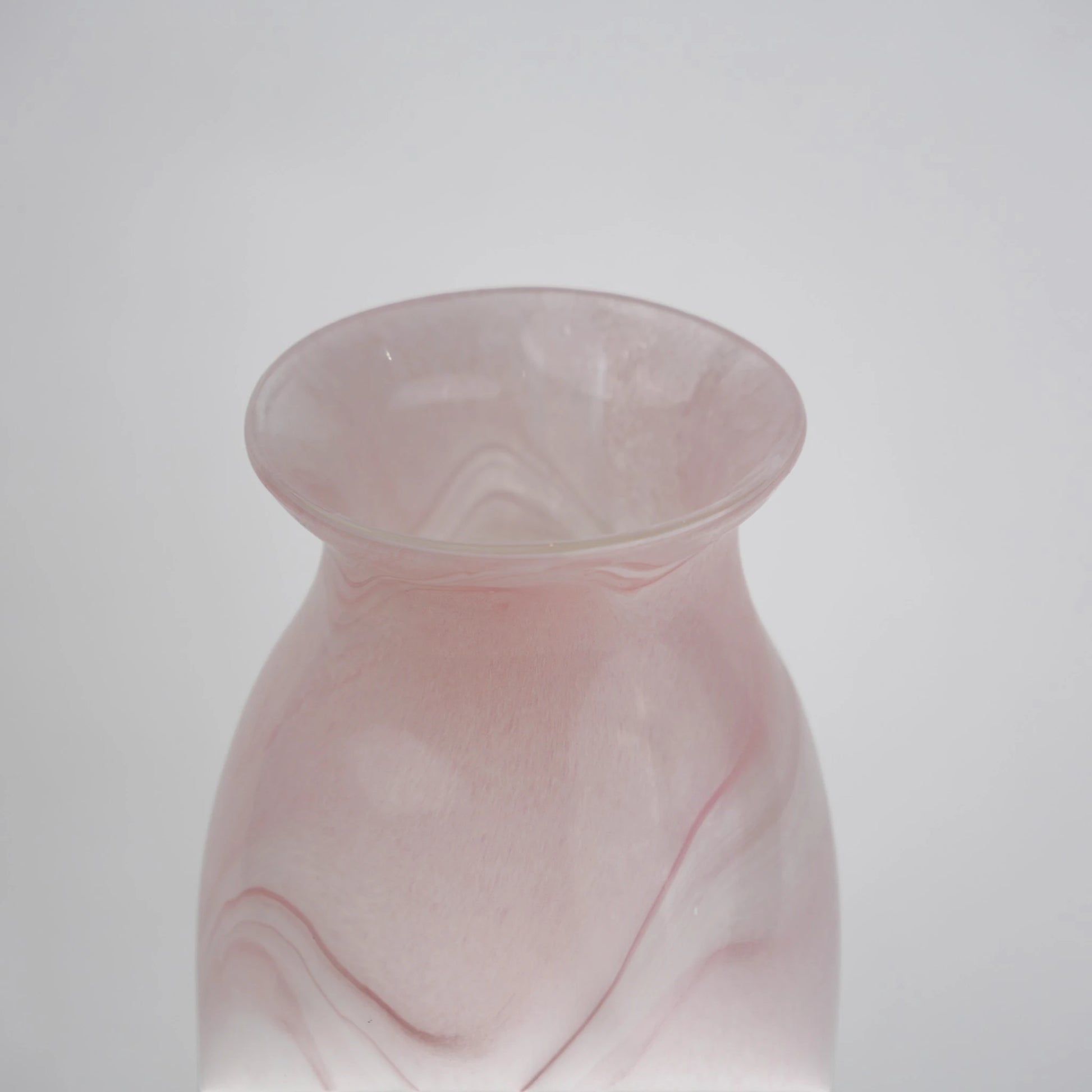 Textured marble-effect glass vase with soft gradient finish and rounded silhouette.