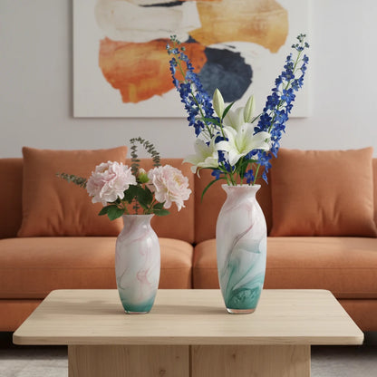 Textured marble-effect glass vase with soft gradient finish and rounded silhouette.