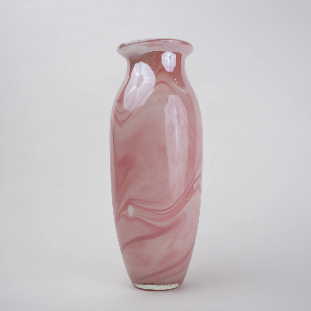 Pink marble glass vase with elongated silhouette and smooth finish.