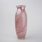Pink marble glass vase with elongated silhouette and smooth finish.