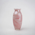 Pink marble glass vase with elongated silhouette and smooth finish.