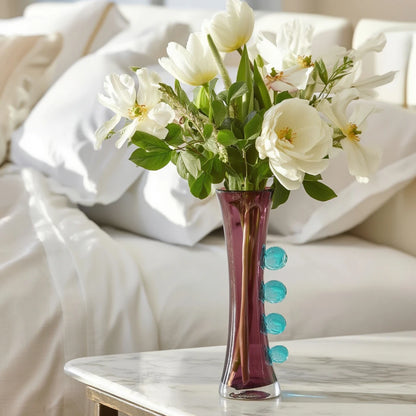 Purple art glass vase with elongated silhouette and raised translucent side accents.