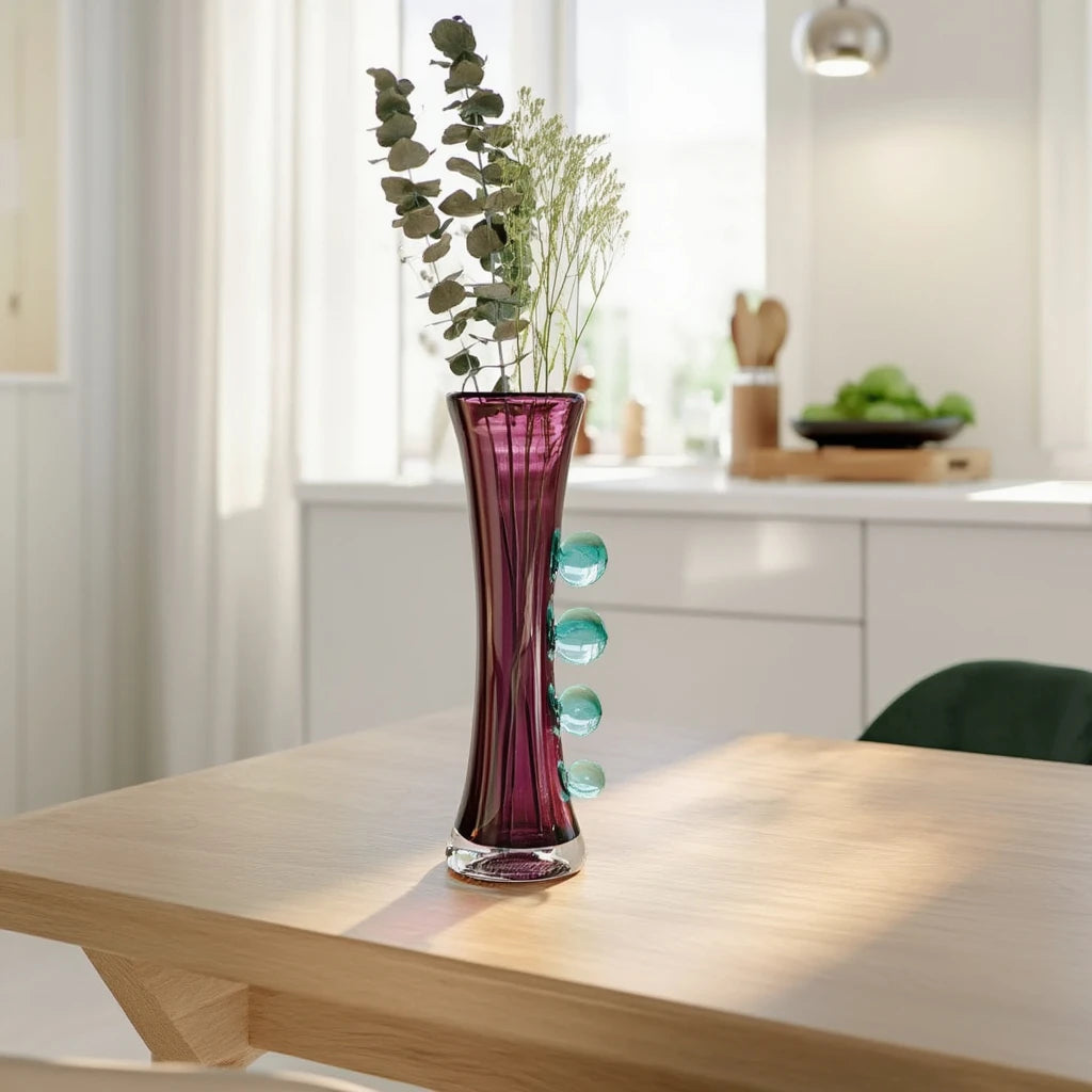Purple art glass vase with elongated silhouette and raised translucent side accents.
