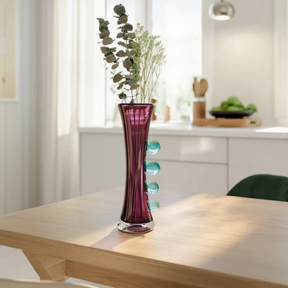 Purple art glass vase with elongated silhouette and raised translucent side accents.