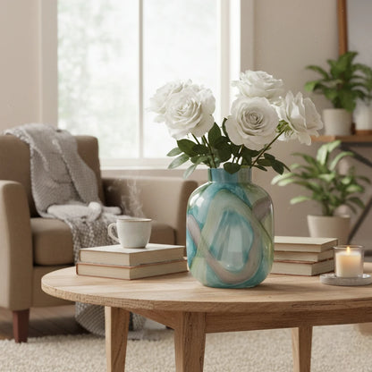Blue marble effect glass vase with a smooth glossy finish, featuring a rounded body and short cylindrical neck, designed as a modern decorative piece for home decor styling.