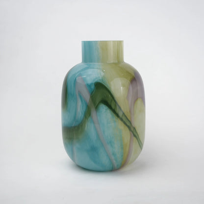 Blue marble effect glass vase with a smooth glossy finish, featuring a rounded body and short cylindrical neck, designed as a modern decorative piece for home decor styling.