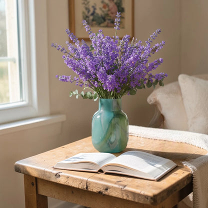 Blue marble effect glass vase with a smooth glossy finish, featuring a rounded body and short cylindrical neck, designed as a modern decorative piece for home decor styling.