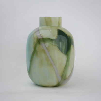 Blue marble effect glass vase with a smooth glossy finish, featuring a rounded body and short cylindrical neck, designed as a modern decorative piece for home decor styling.